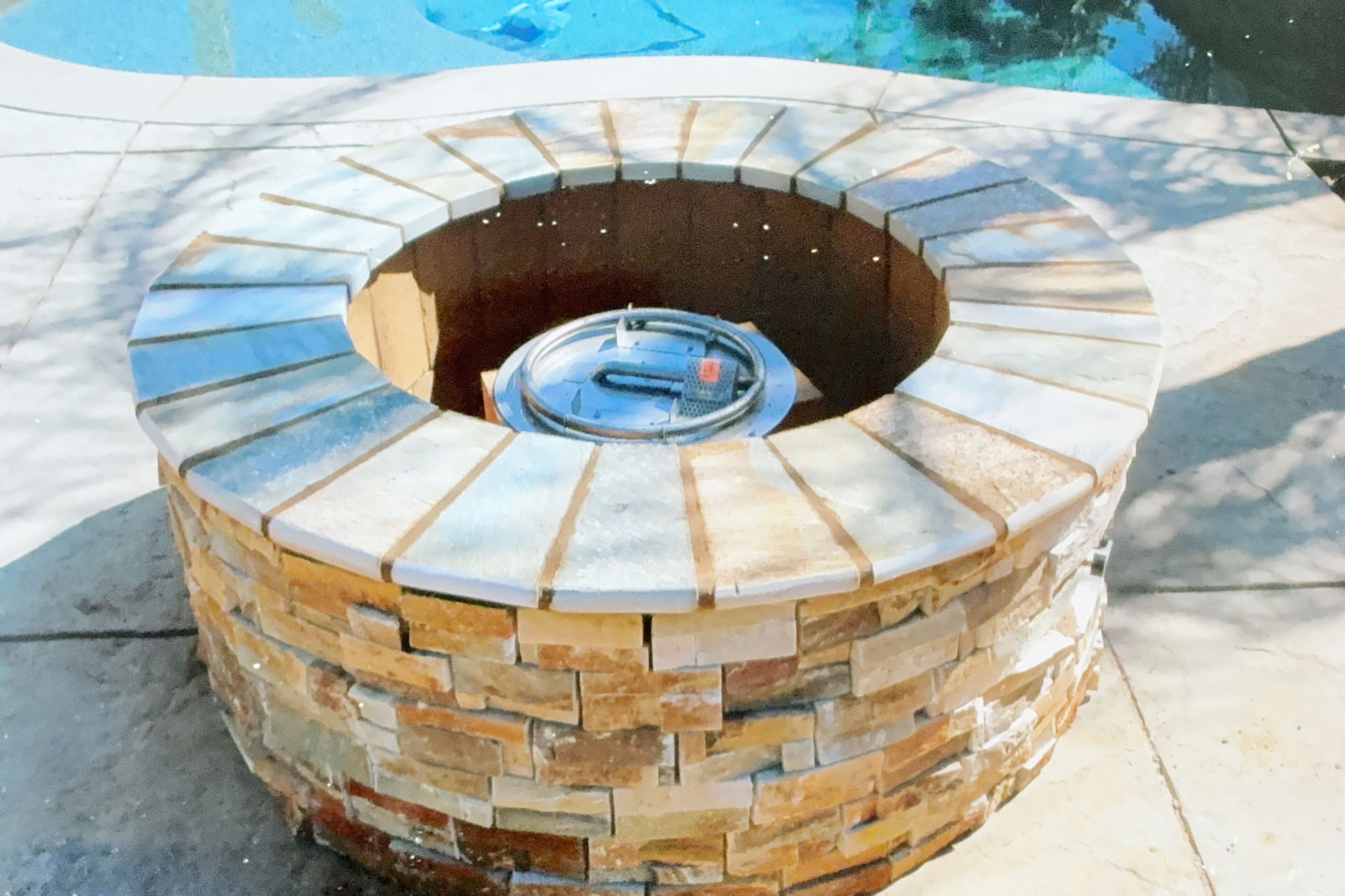 Custom stone fire pit installation