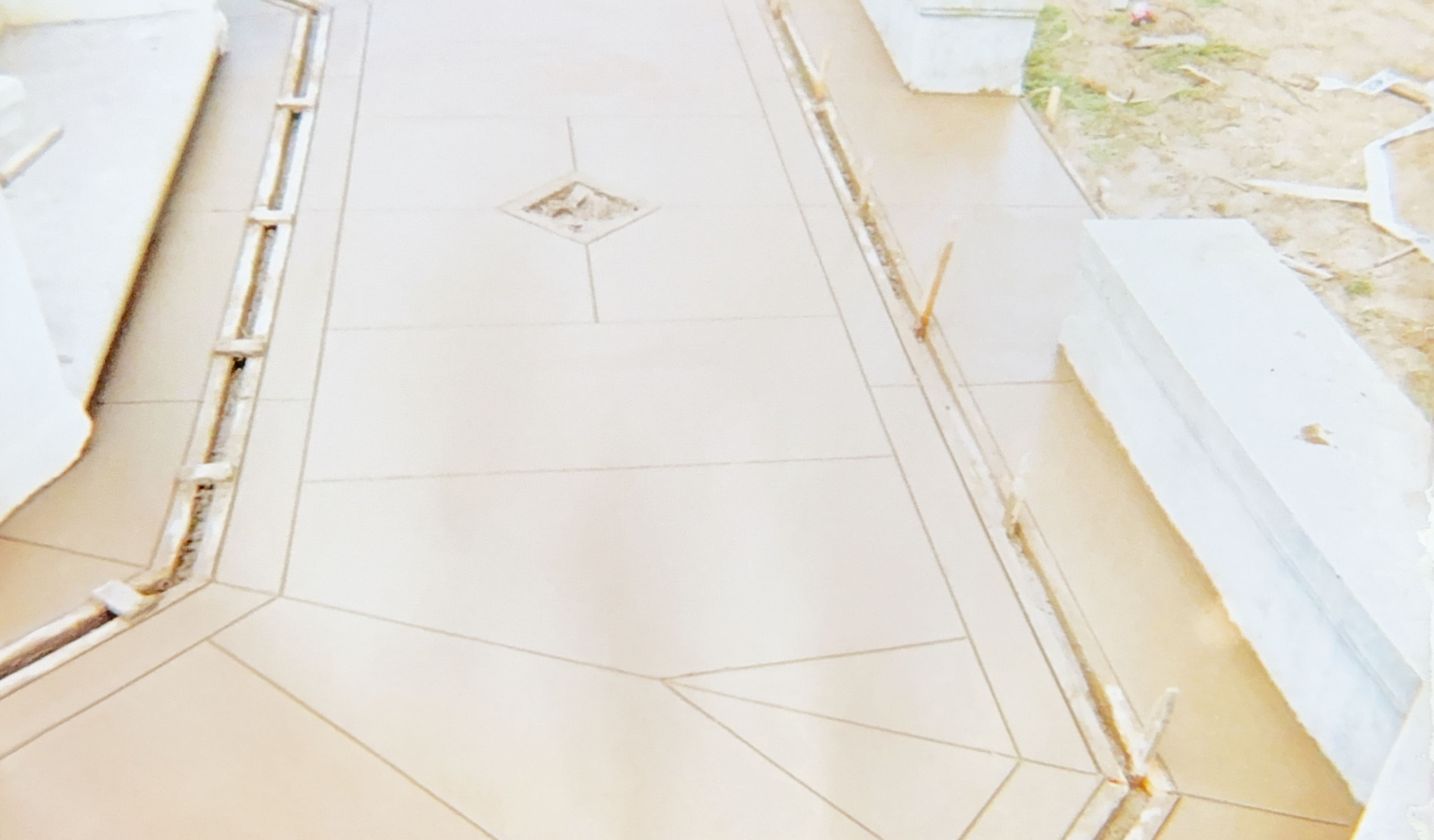 Custom concrete pathway with decorative diamond pattern