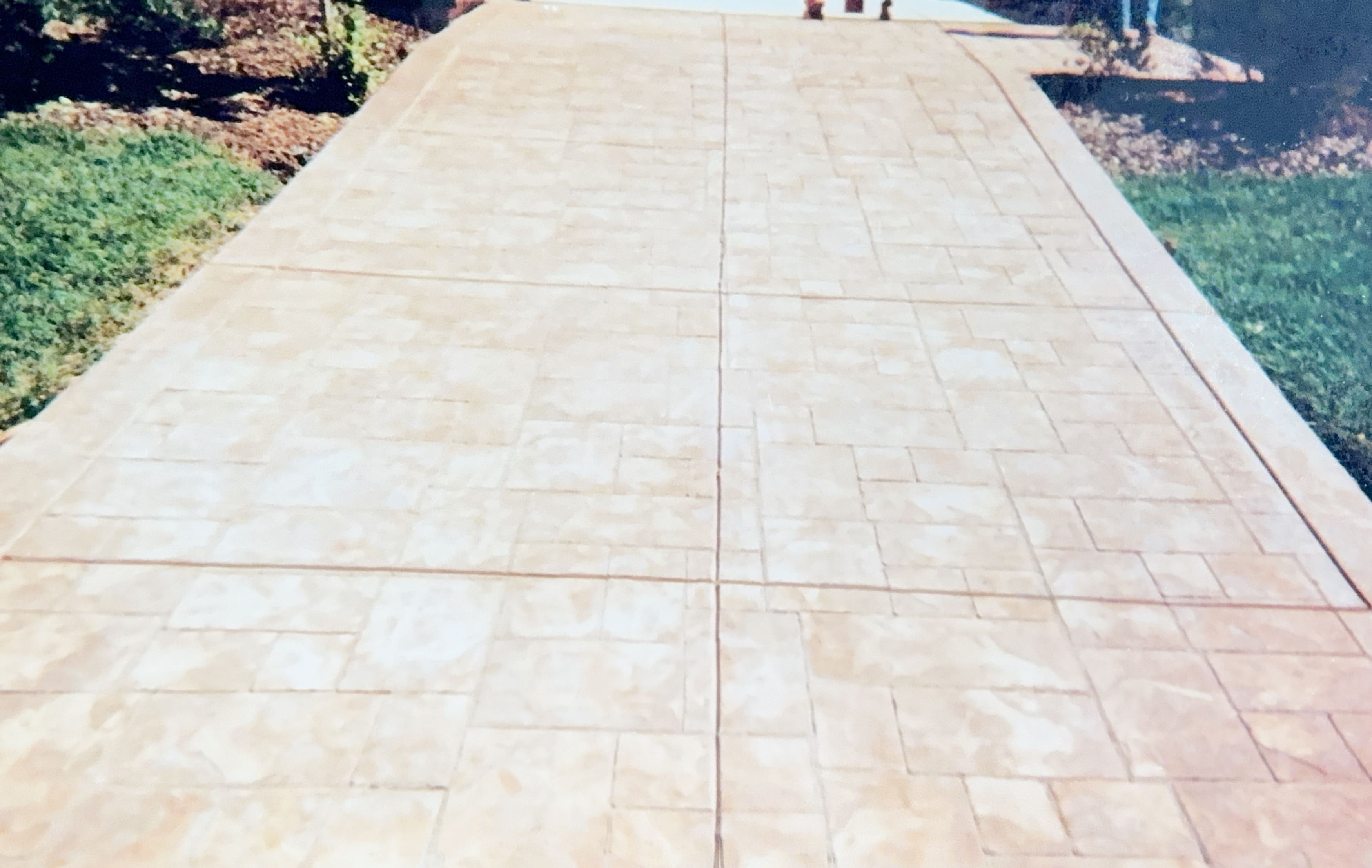 Stamped concrete driveway with stone texture