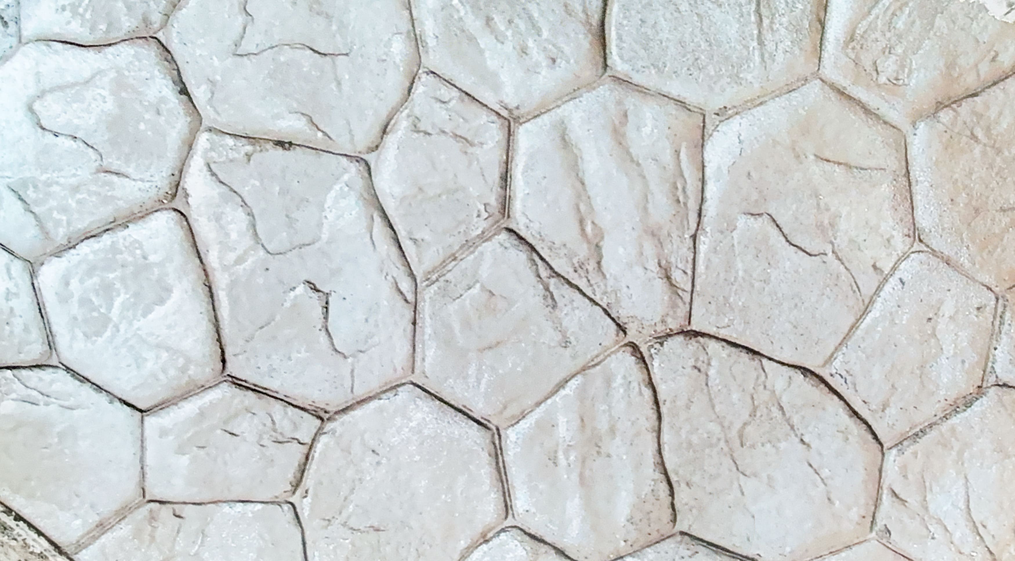 Close-up of stamped concrete with an irregular stone pattern