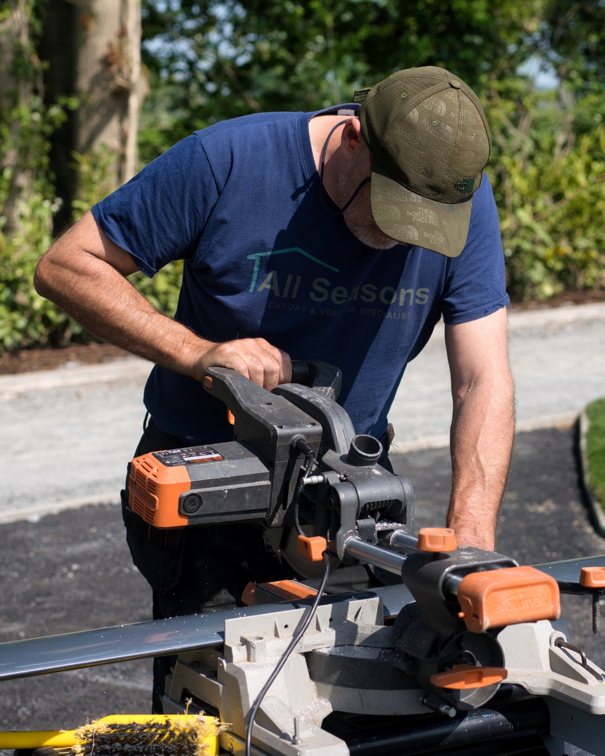 Construction worker using saw