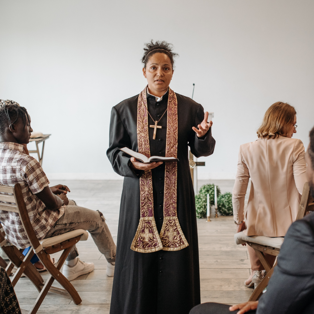 Faith leader speaking with members of a congregation