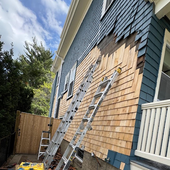 Exterior cedar shake siding replacement in Oakdale