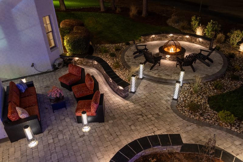 Two-tier paver patio and outdoor lighting at night at Brier Creek Country Club