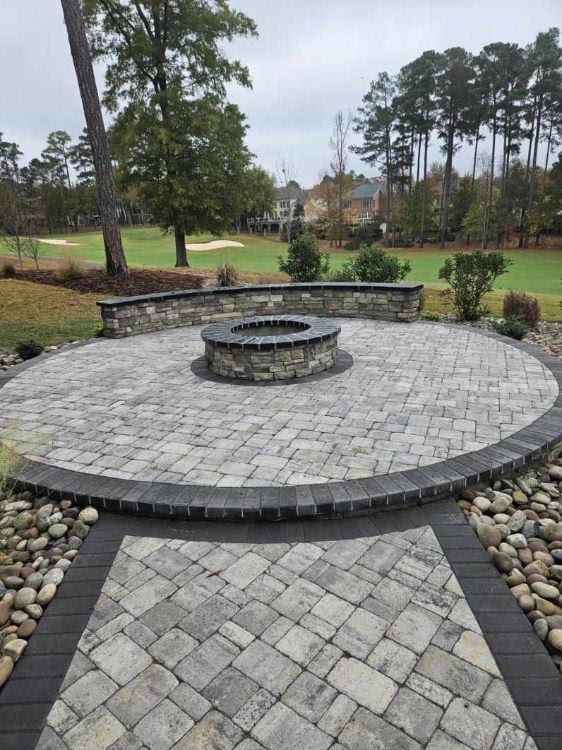 Custom circular paver patio with fire pit overlooking Brier Creek golf course