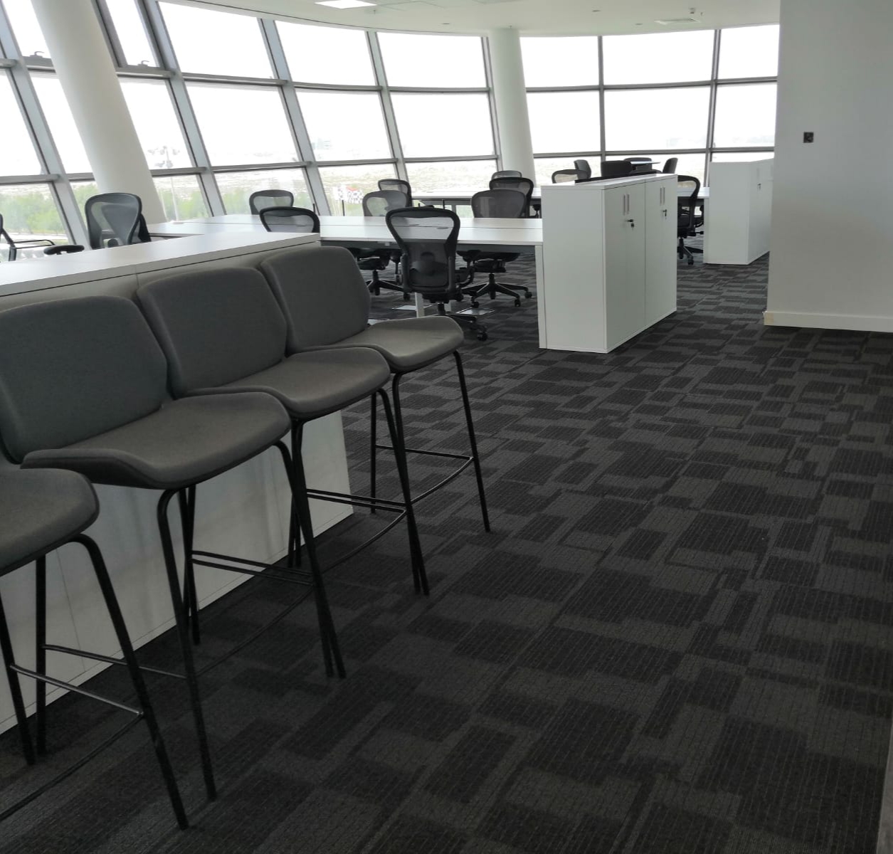 Custom carpet tiles installation in office and hospitality space