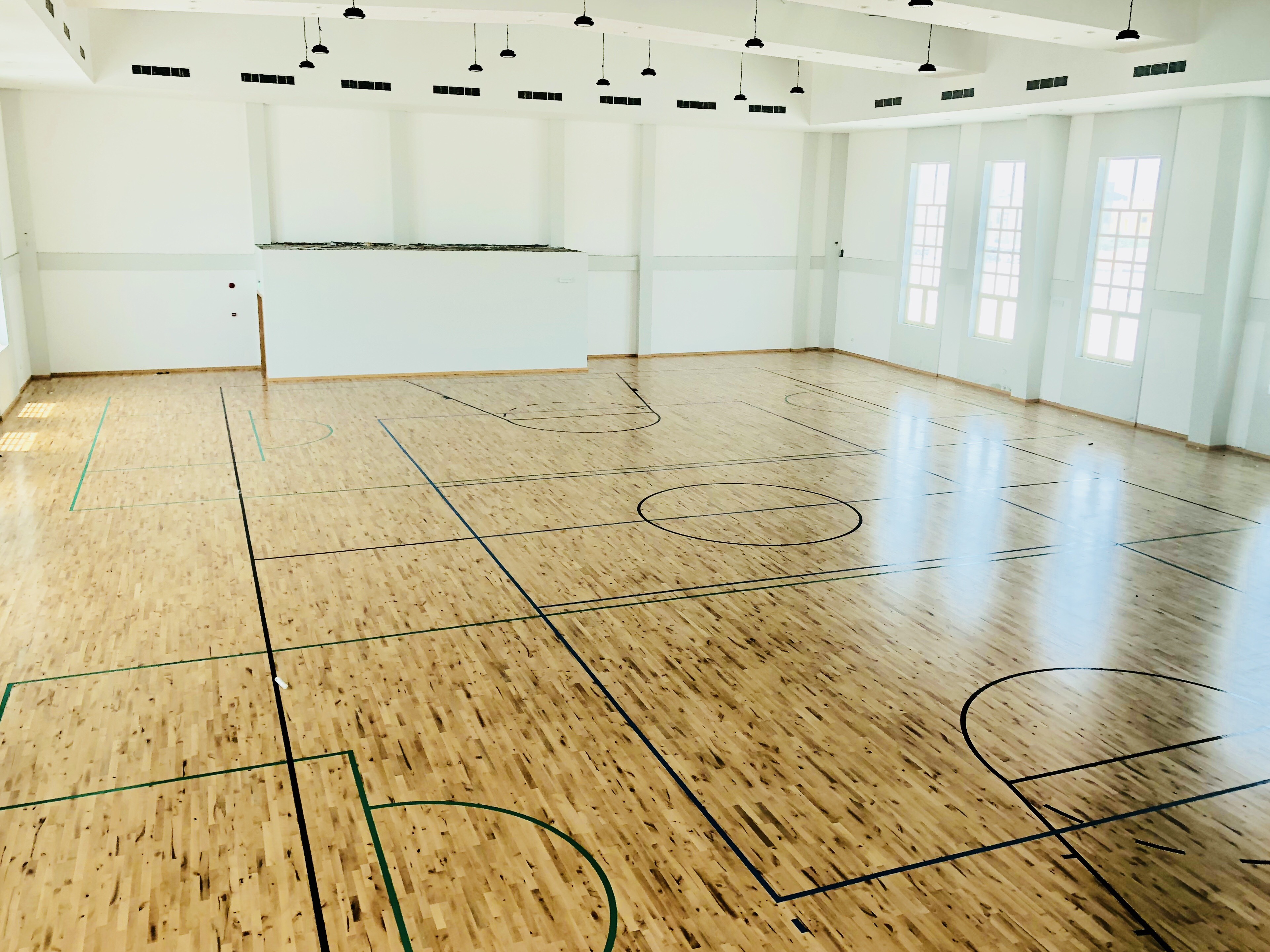 Junckers solid hardwood flooring installation in Bahrain sports hall