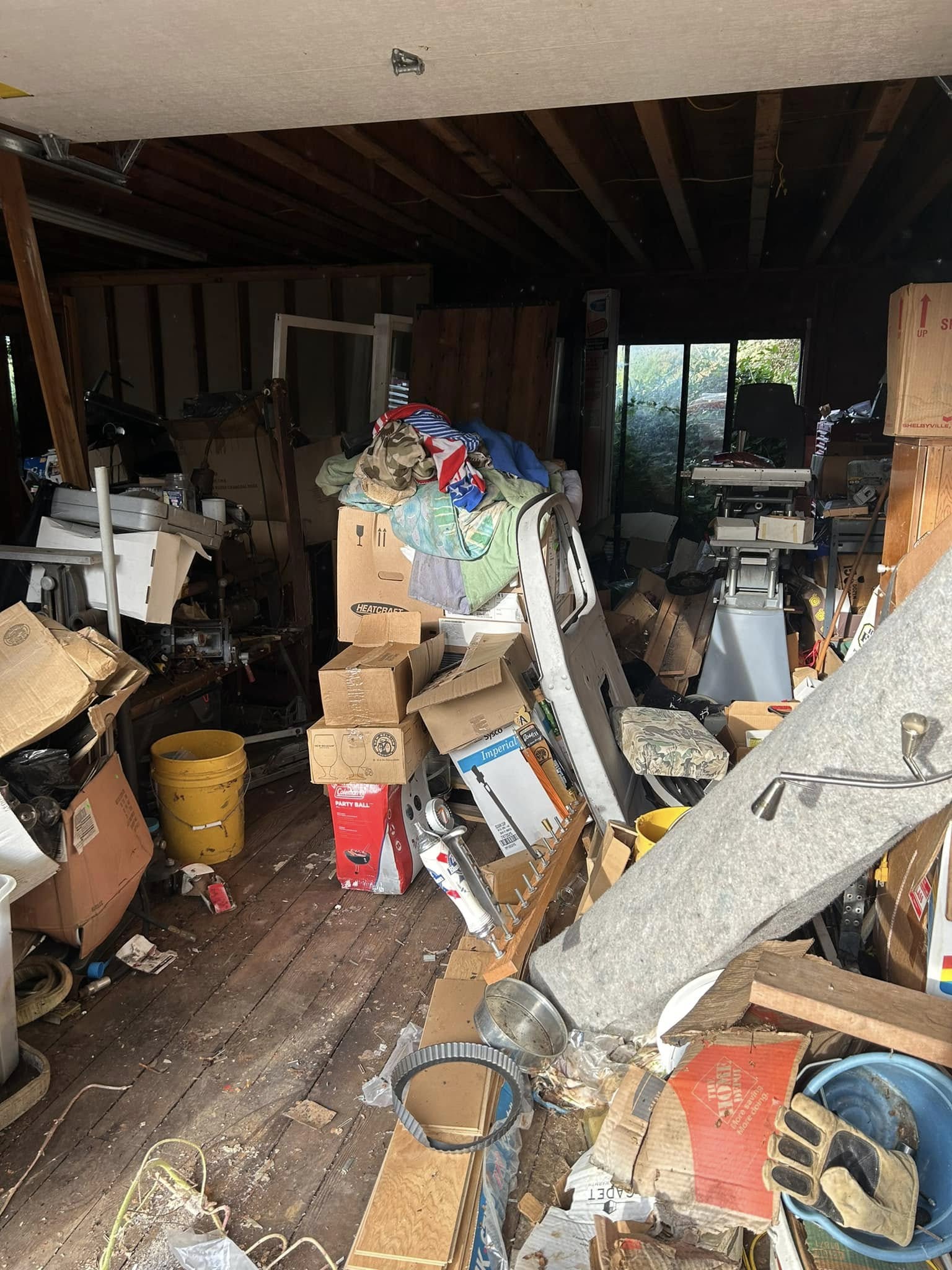 Packed garage before junk removal cleanout in Grants Pass