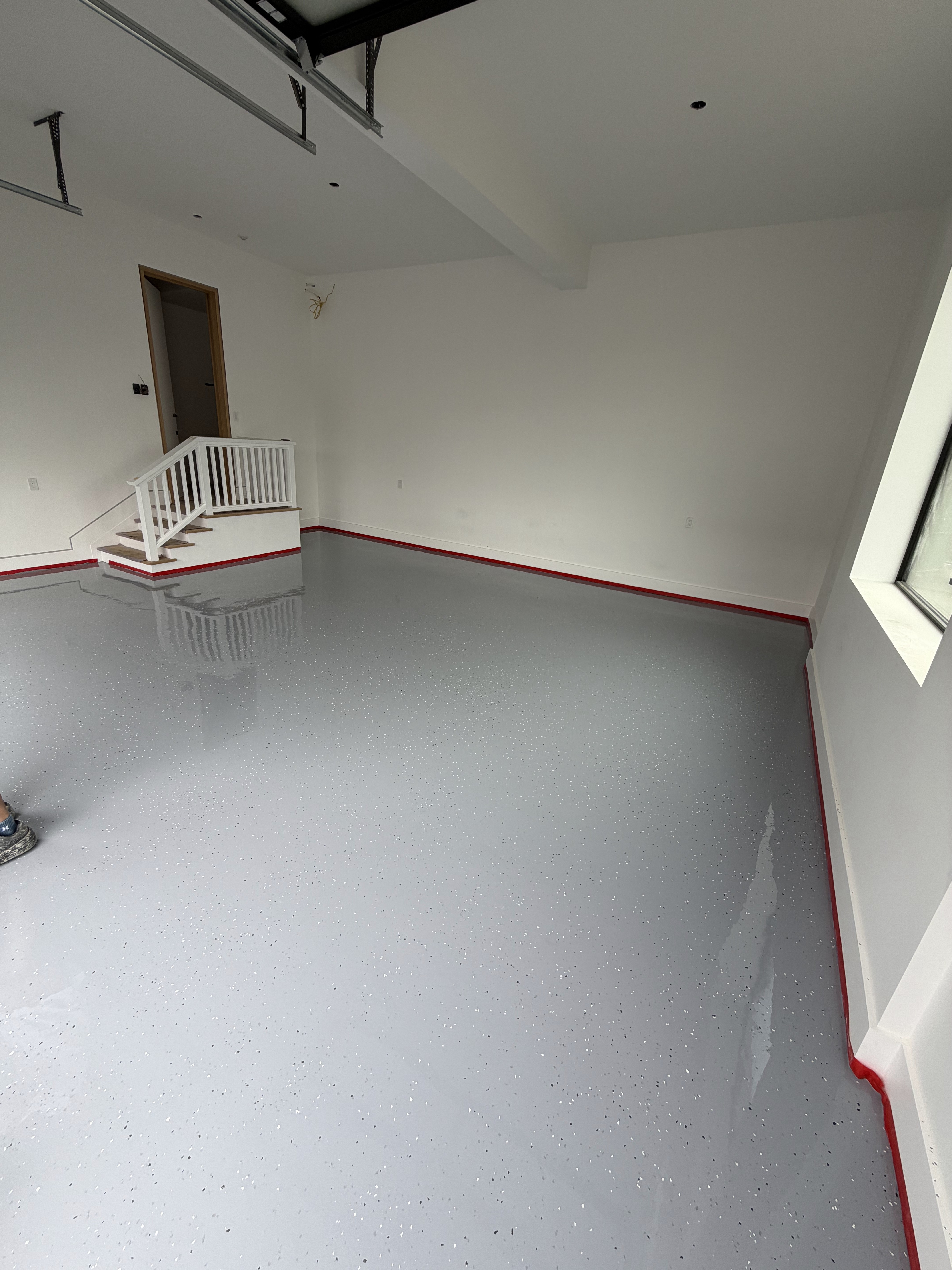 Pristine garage floor with fresh epoxy coating