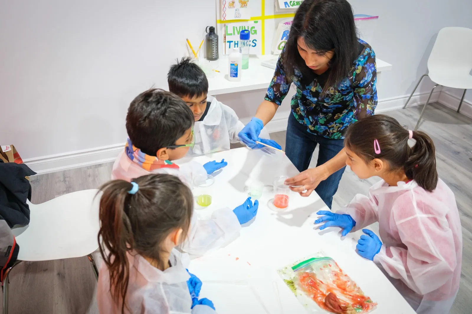 BioTroopers campers in lab coats doing an experiment