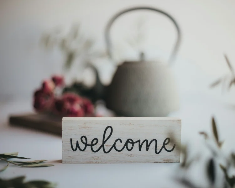 Welcome sign with teapot