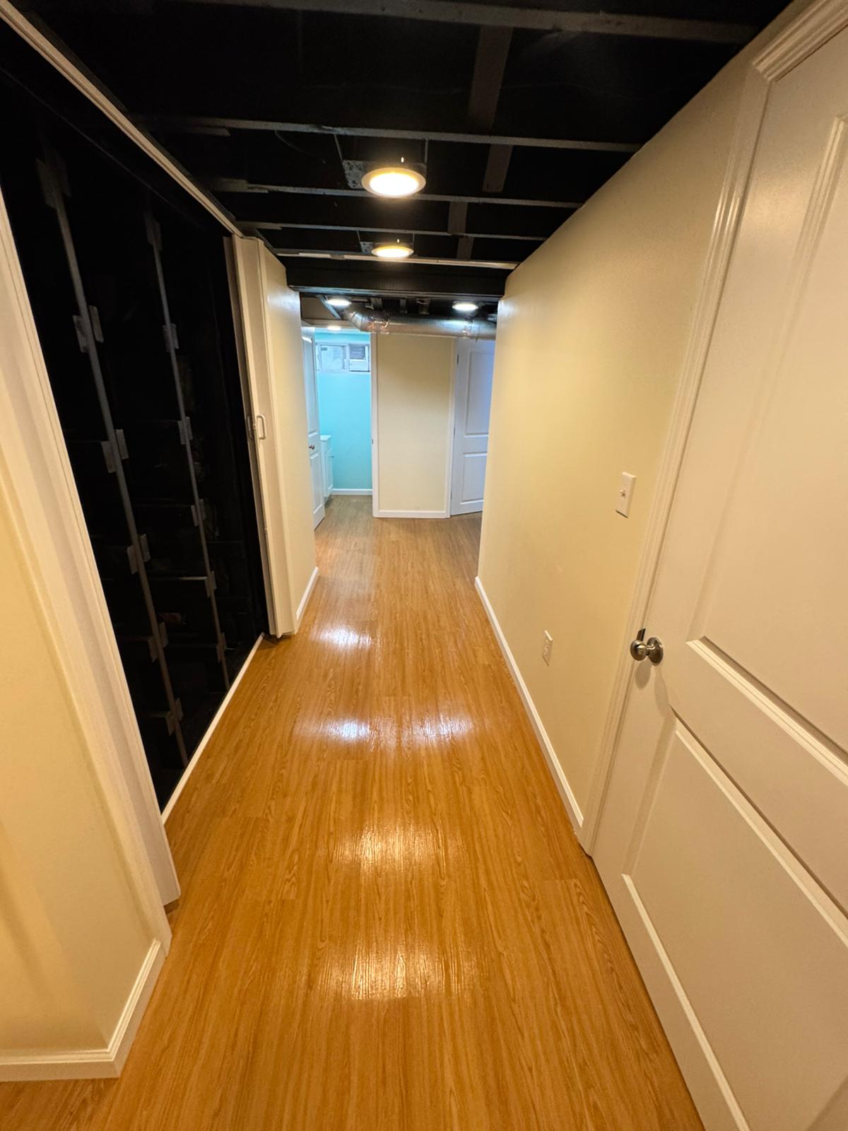Basement renovation with finished walls by A Kingdom Construction Co.