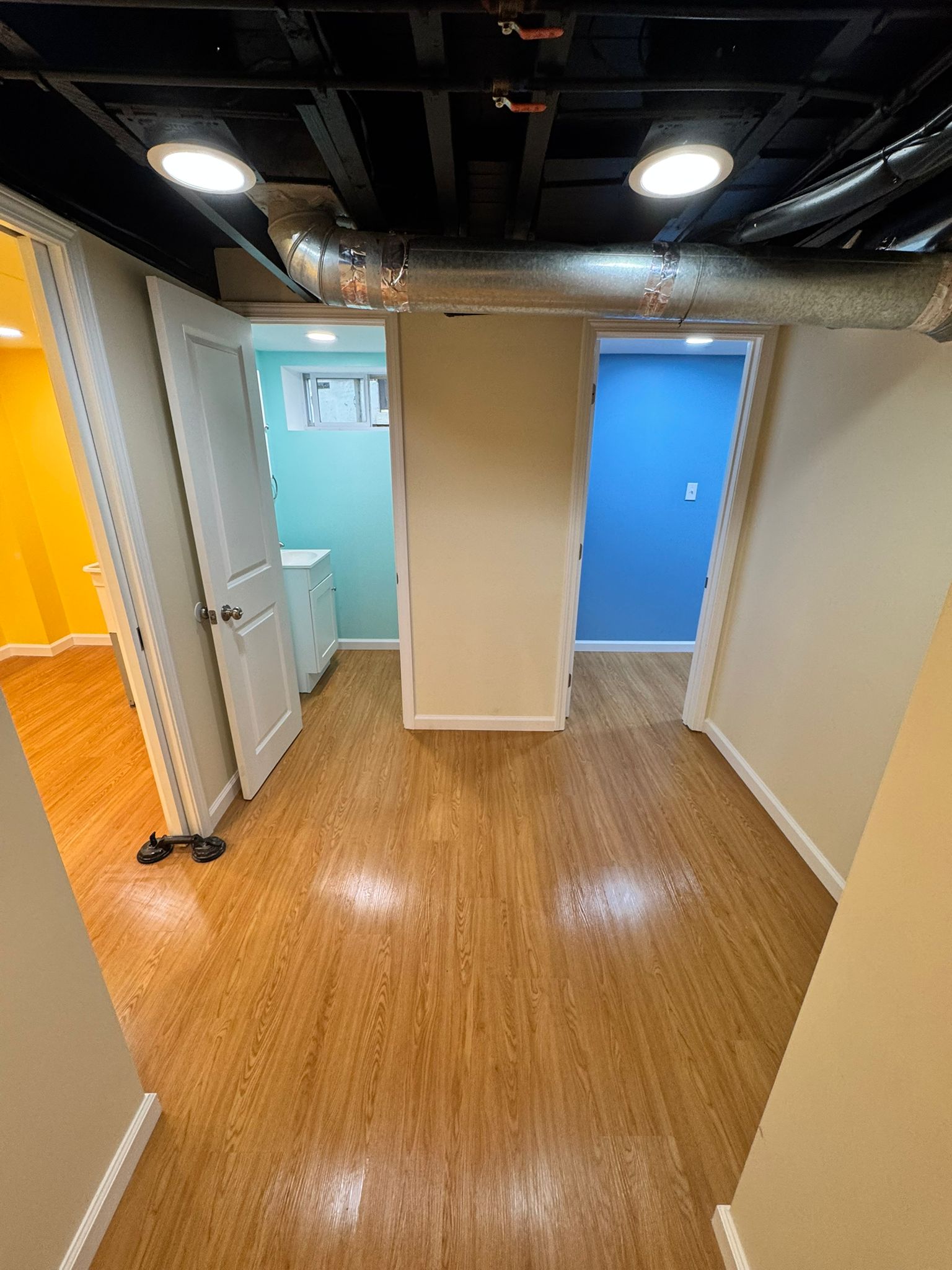 Finished basement living space by A Kingdom Construction Co.