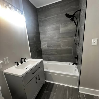 Bathroom renovation with tile shower by A Kingdom Construction Co.