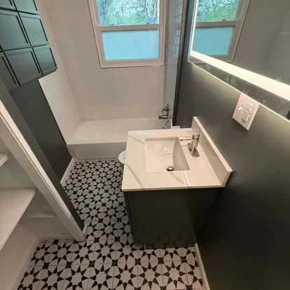 Walk-in shower bathroom remodel by A Kingdom Construction Co.