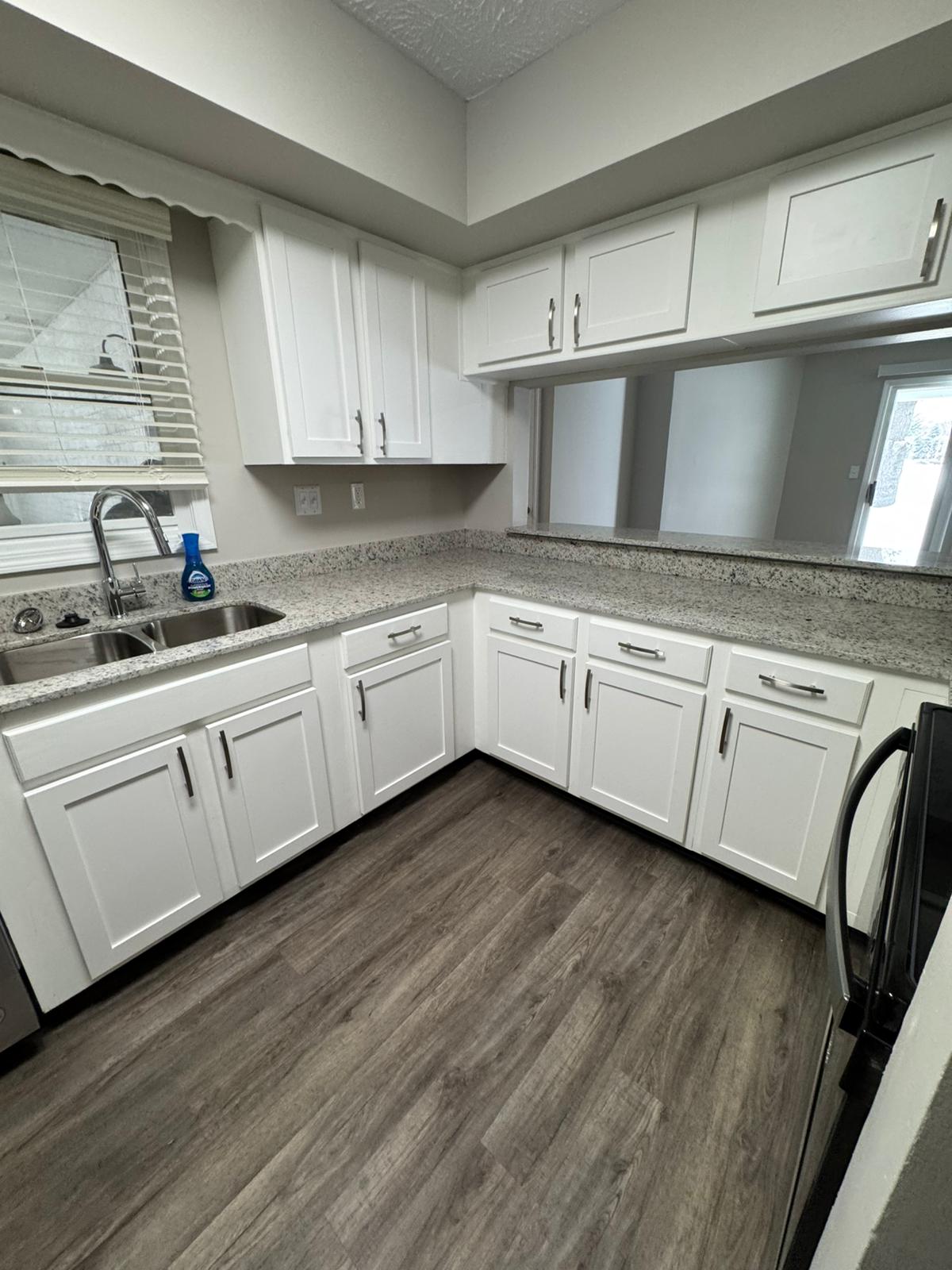 Kitchen renovation with tile backsplash by A Kingdom Construction Co.