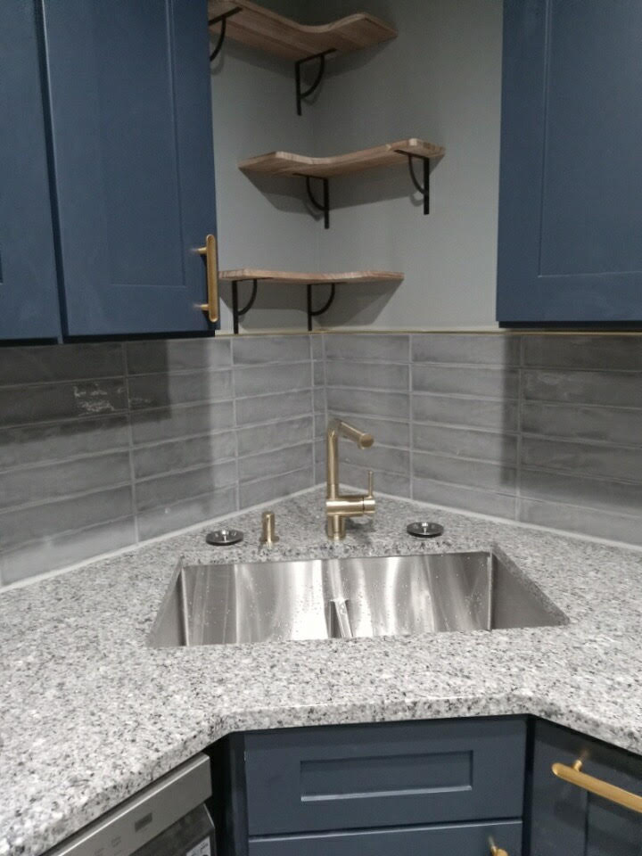Kitchen renovation with island by A Kingdom Construction Co.