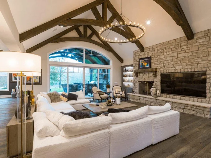 Great room with exposed beam drywall ceiling