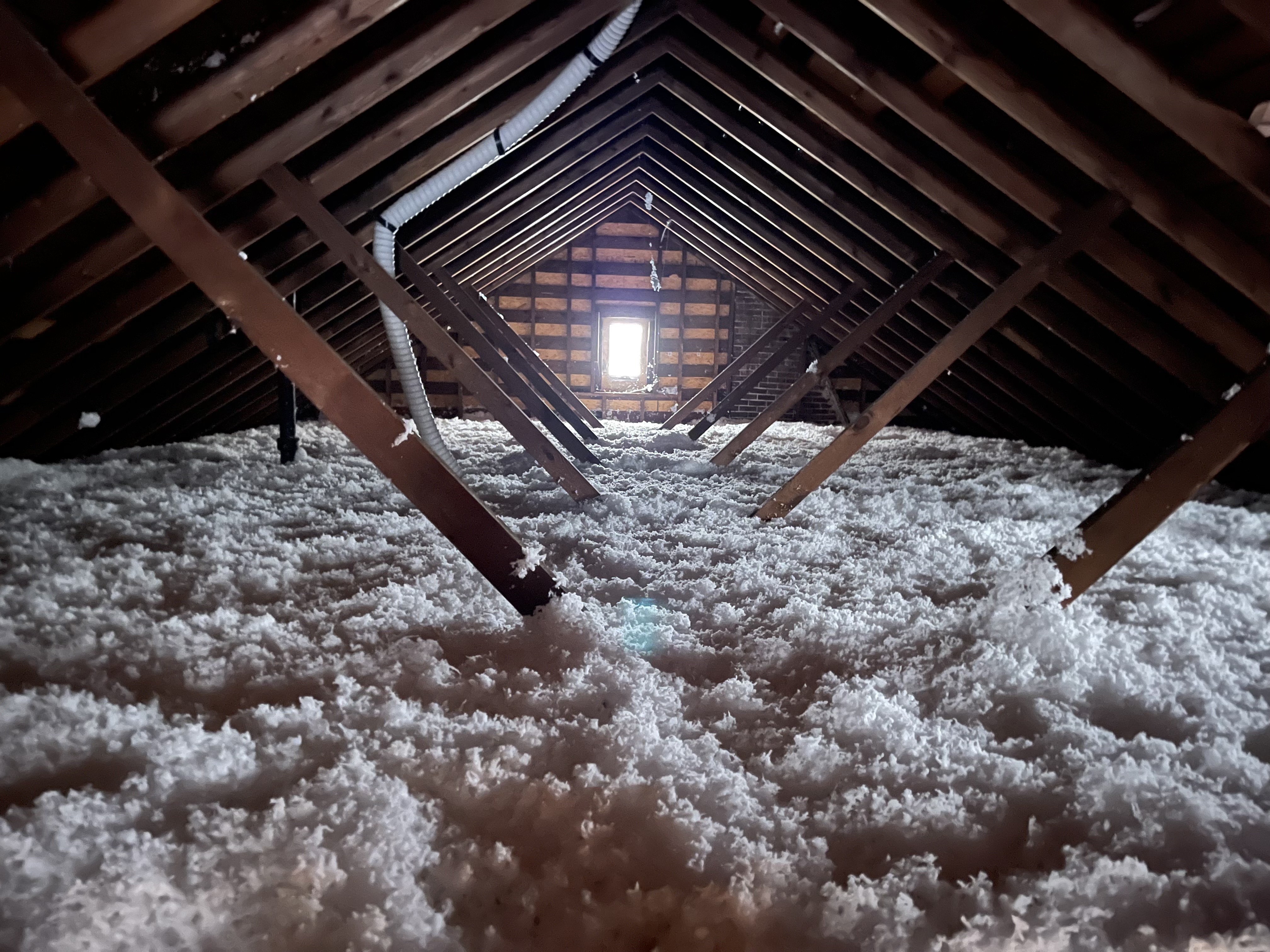 Freshly installed blown-in insulation in an attic