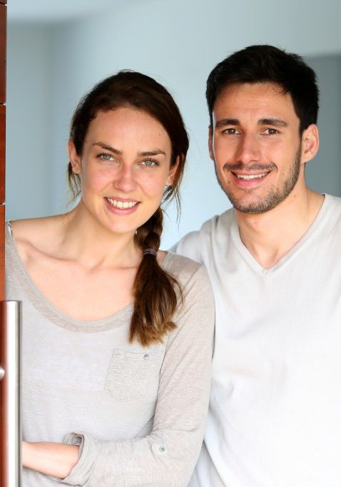 Happy couple opening new home