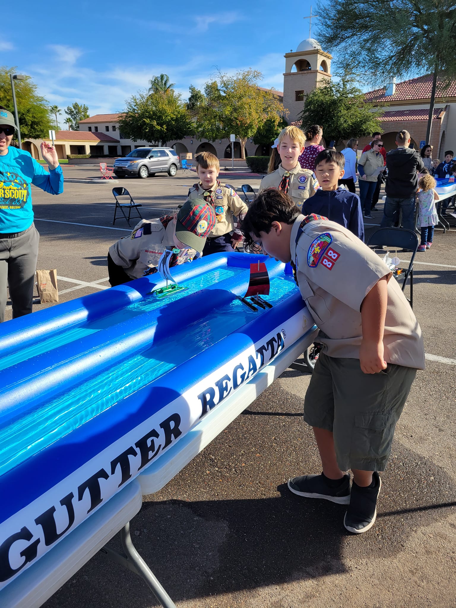 Cub Scouts in Gilbert AZ playing Rain Gutter Regatta at a Pack 88 meeting
