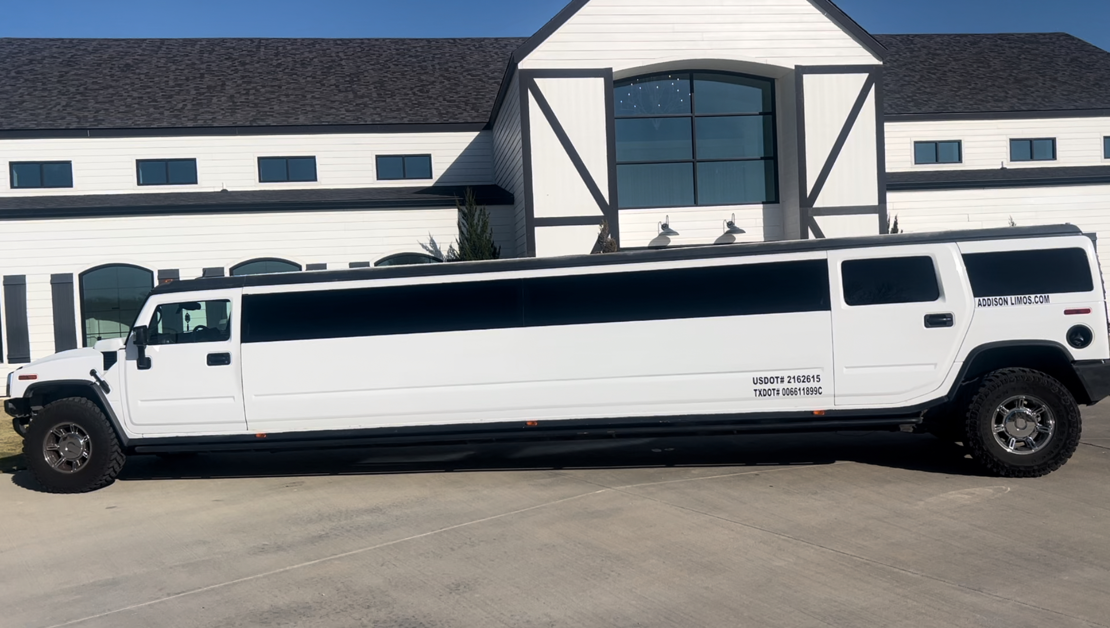 White Hummer Limousine at a venue