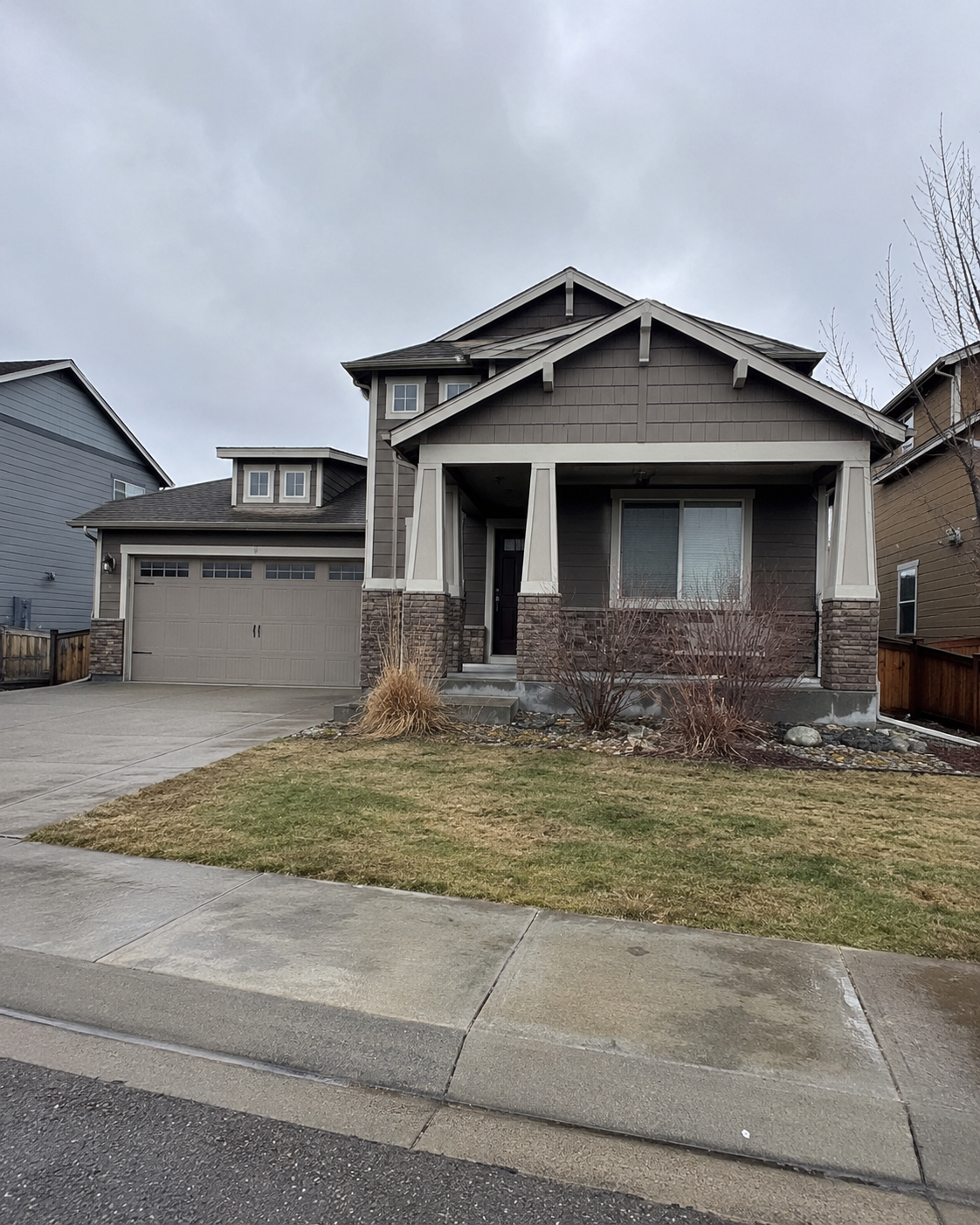 Before AI video optimization - flat overcast exterior photo of suburban real estate listing with gray sky and muted colors