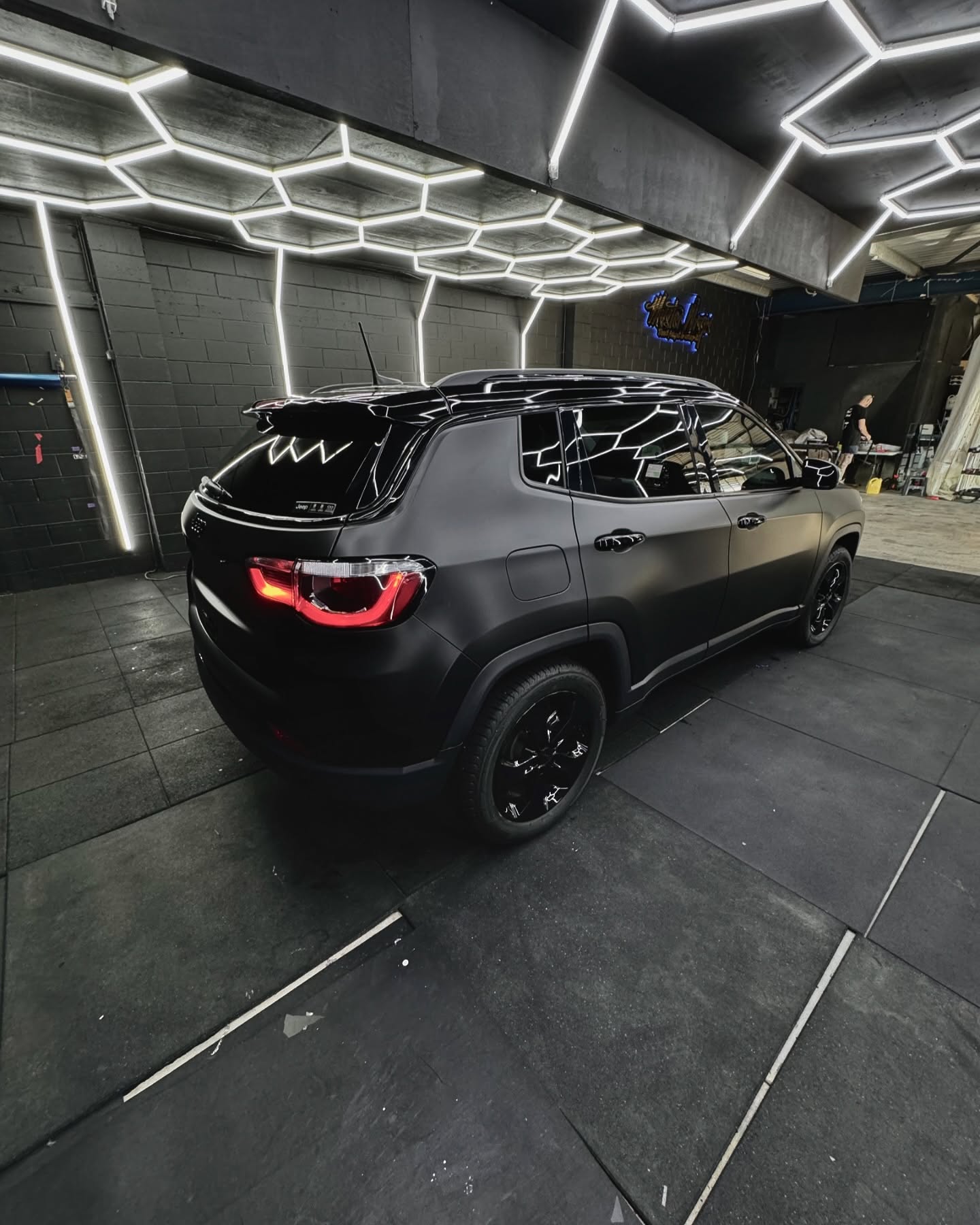 Matte black Jeep SUV rear quarter view wrapped at Master Wraps