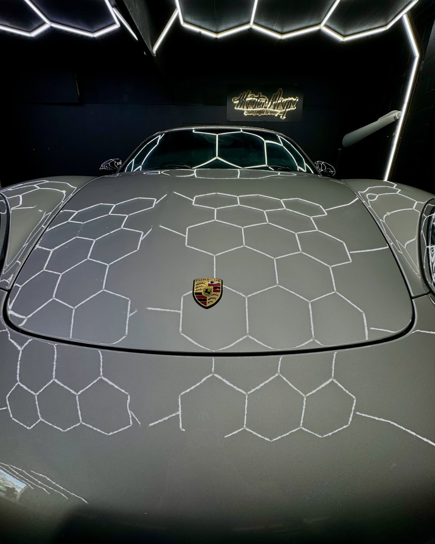 Close up of silver Porsche hood showing flawless wrap installation