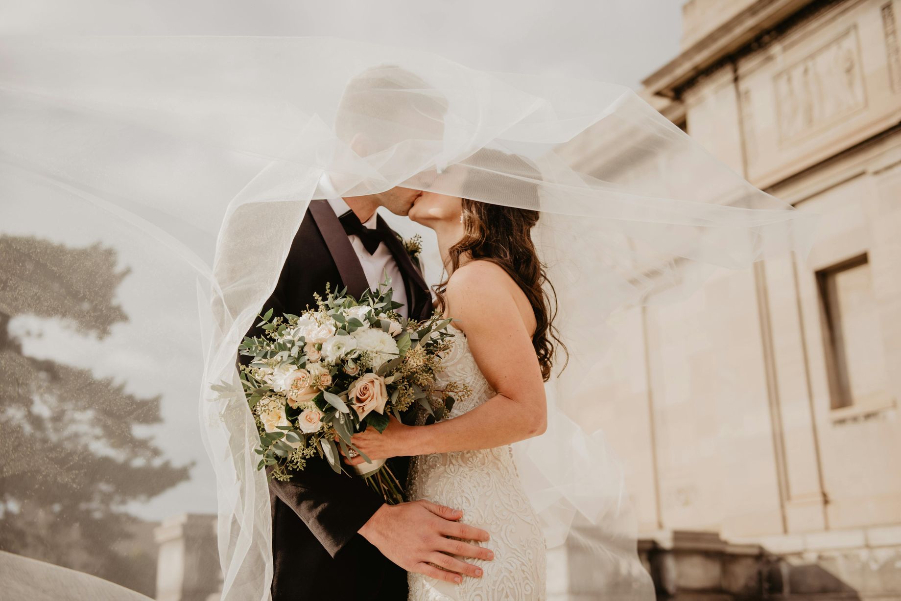 Romantic couple kissing at wedding ceremony