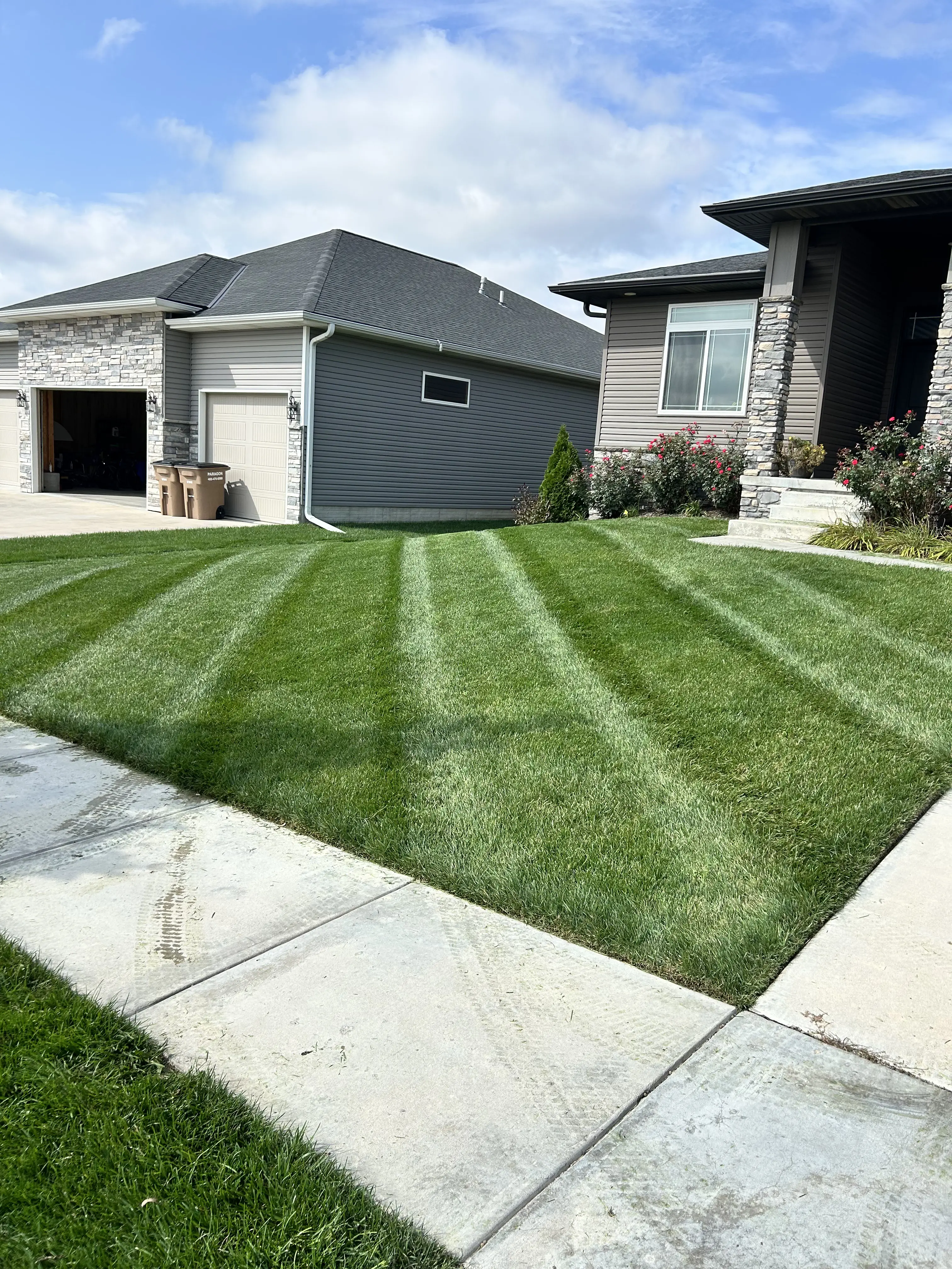 Crisp striped lawn maintenance on Lincoln, NE residential property