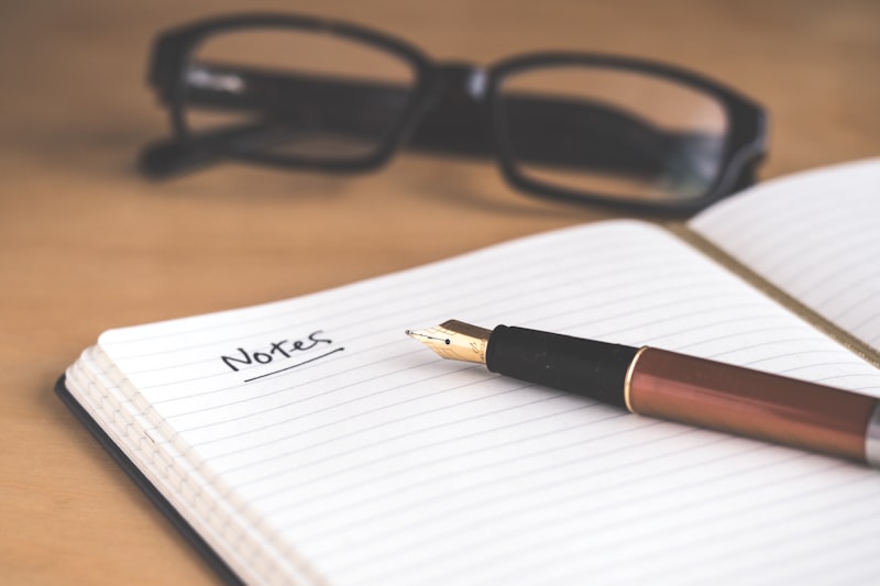 Open journal with handwritten personal story beside a cup of coffee, Inkspire Literary Studio memoir writing guidance