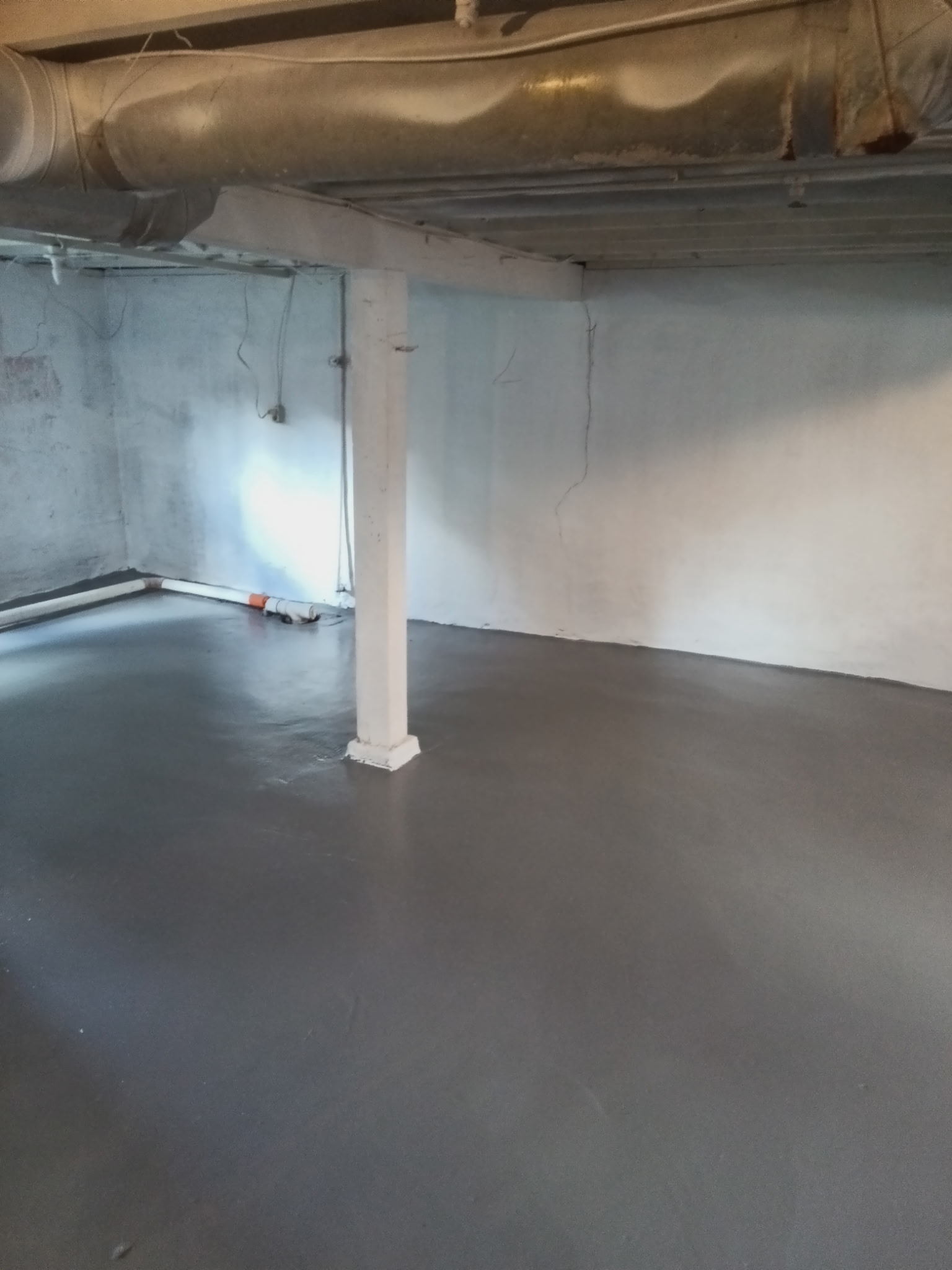 Basement floor coating and support post restoration in South Central