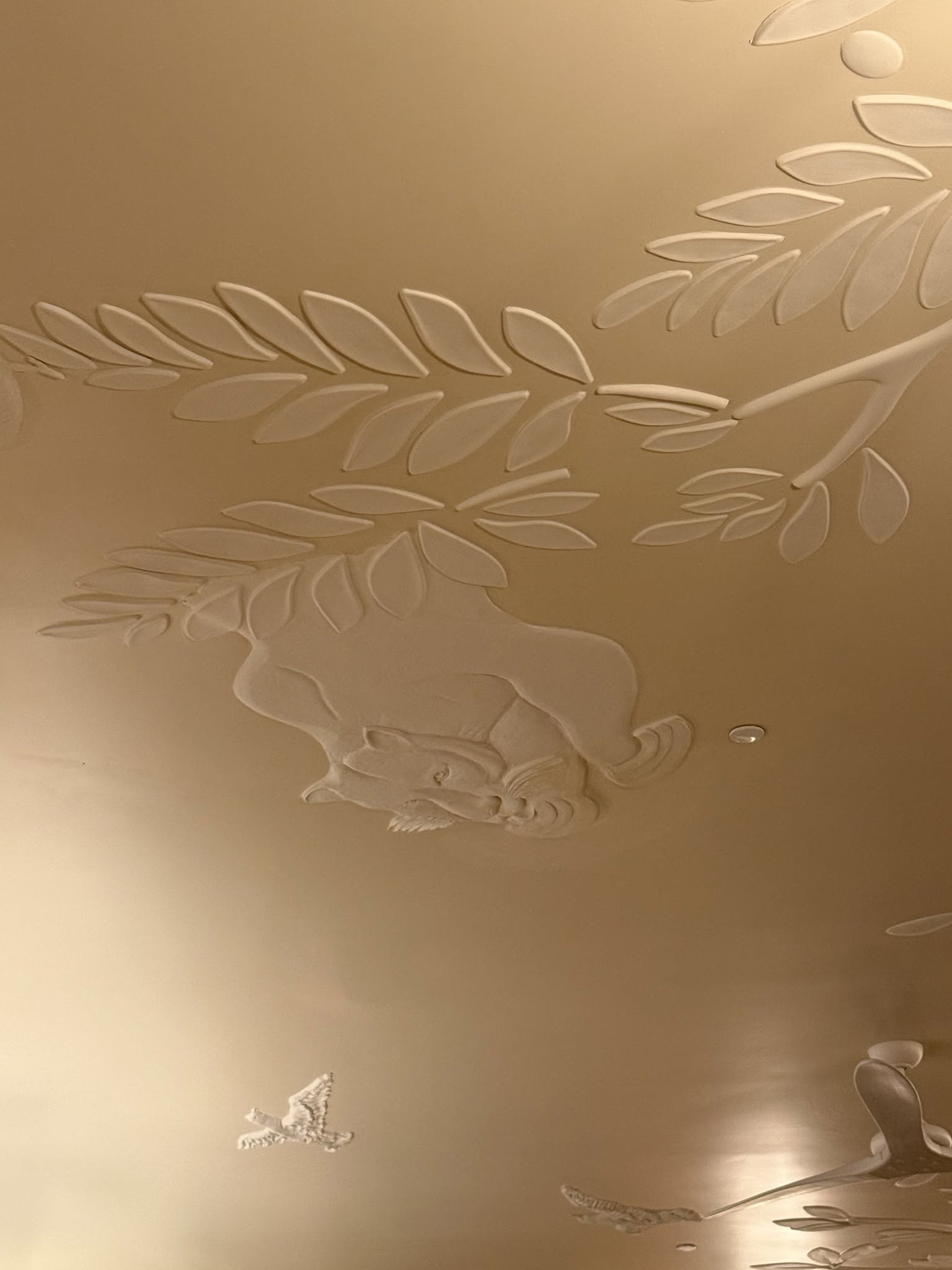 Sculpted leopard ceiling detail at Coco's - a subtle tribute to the legendary Leopard Lounge