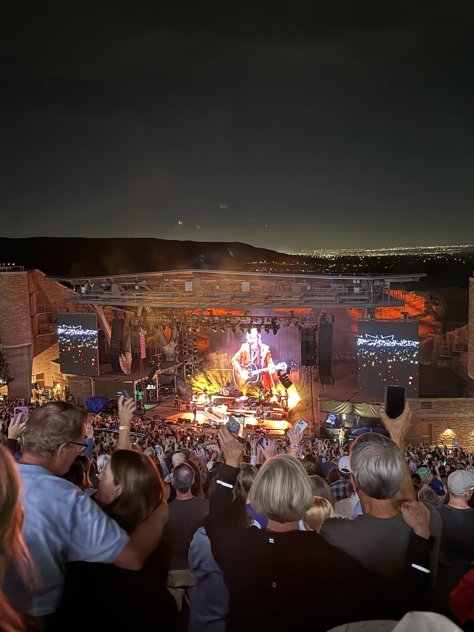 Brandi Carlile performing live at Red Rocks Amphitheatre under the night sky