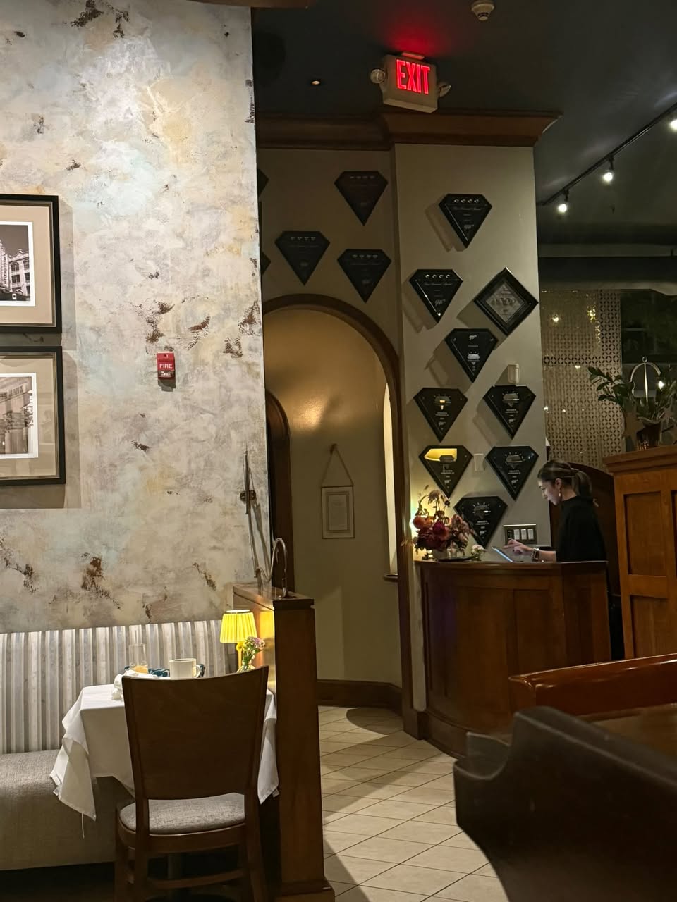 Gracie's archway entrance and awards wall displaying accolades over decades