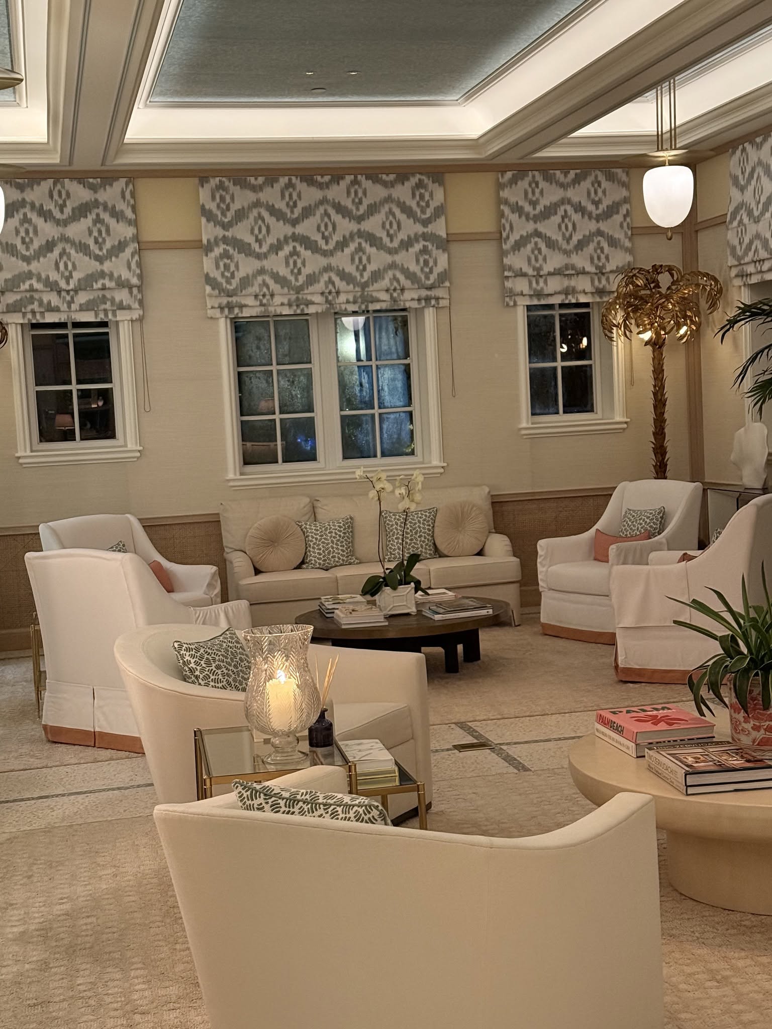 The Chesterfield Hotel lobby - elegant living room style with cream furnishings and tropical accents