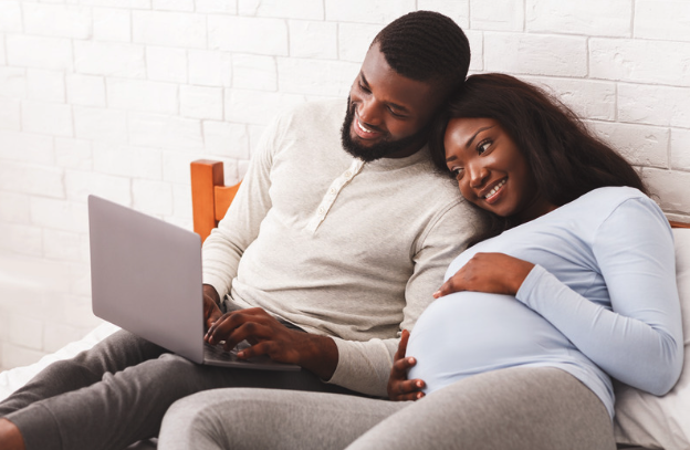 Expectant parents preparing together for breastfeeding through an online class.
