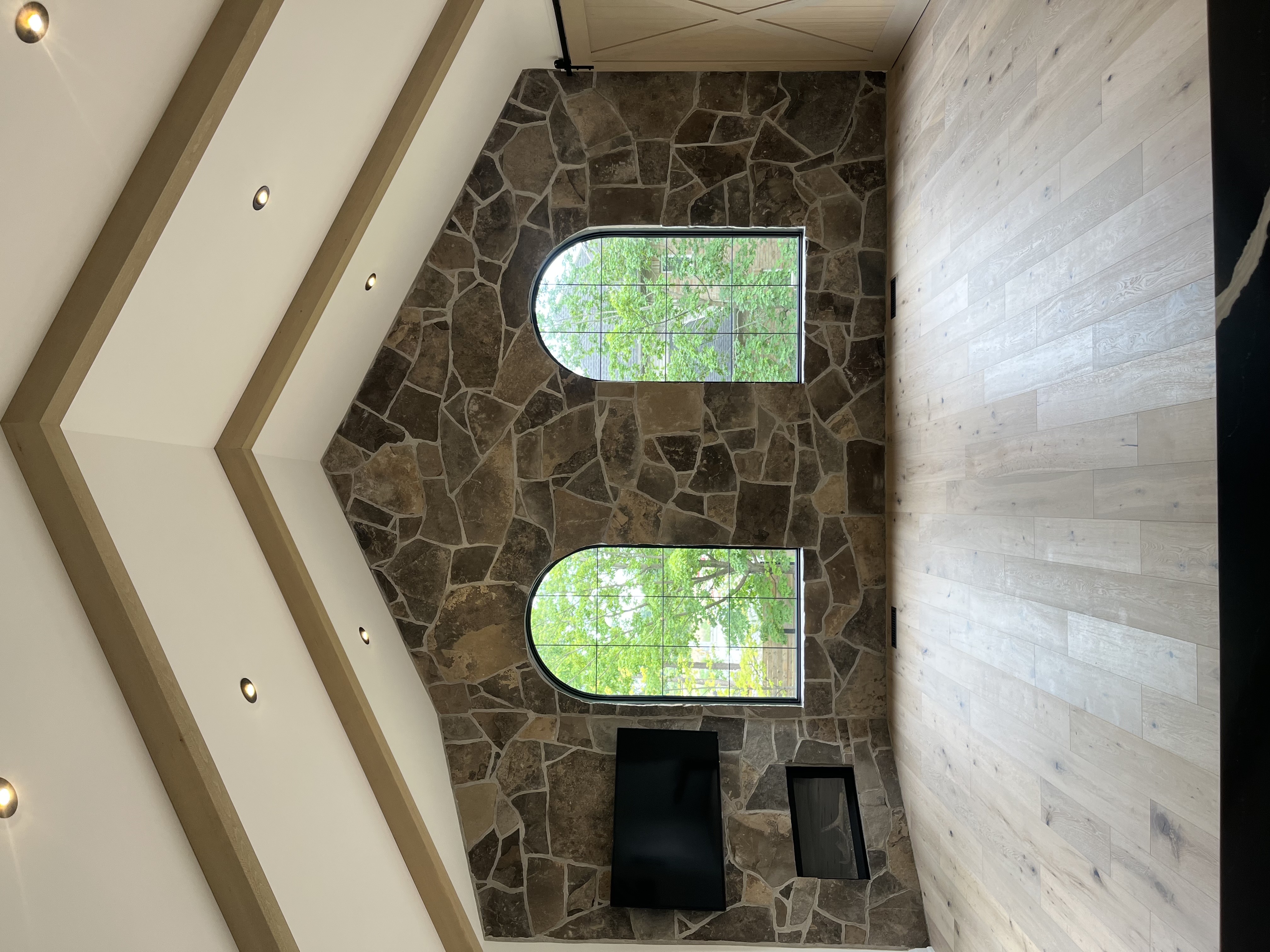 Interior stone feature wall with cathedral ceiling — natural fieldstone