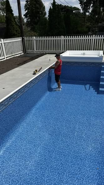 Pool liner installation in progress
