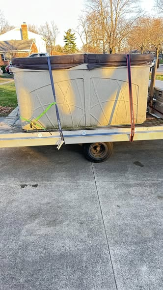 Hot tub loaded on a trailer for transport