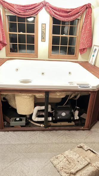 Indoor hot tub with access panel removed