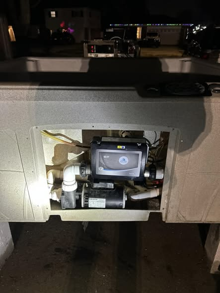 Hot tub equipment panel at night