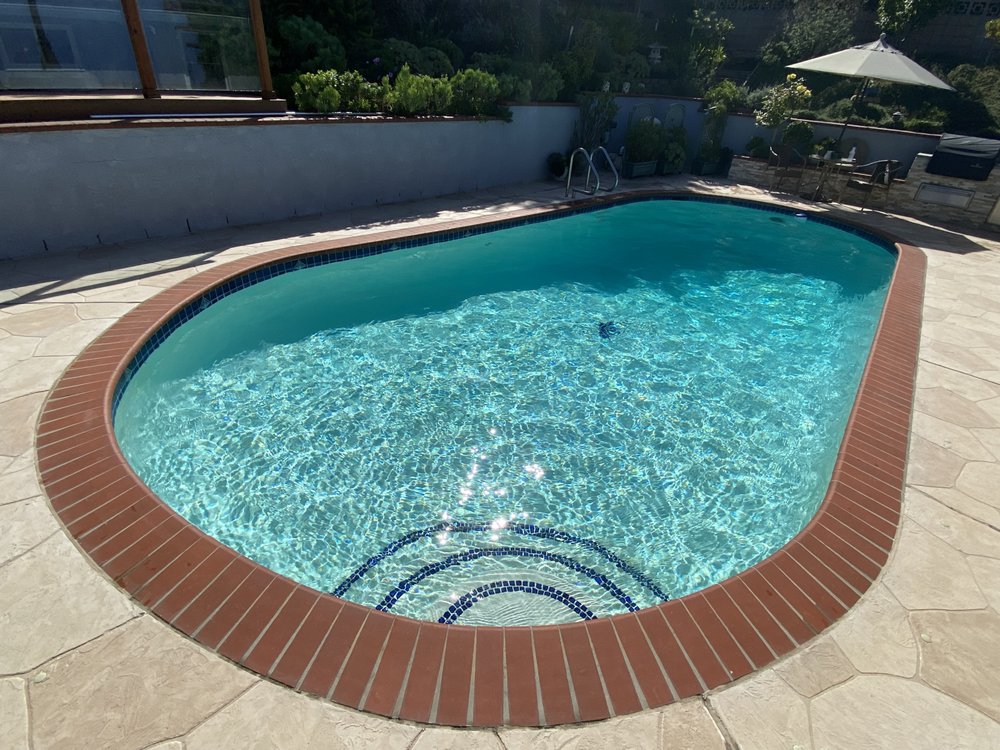 Pool equipment area with a clean filter cartridge removed for maintenance