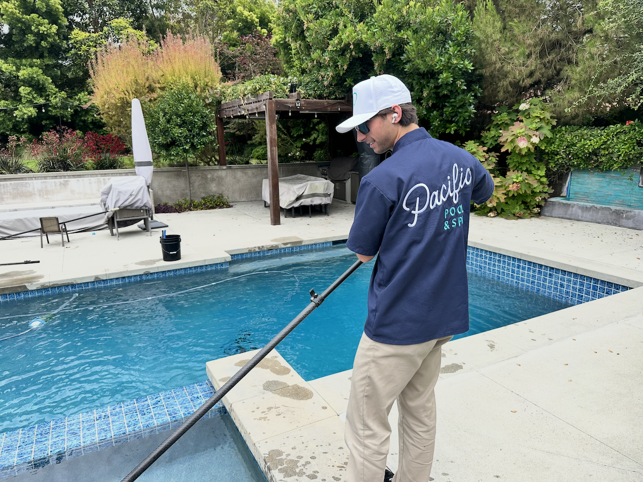 Pacific Pool & Spa technician performing professional pool cleaning in Torrance, CA