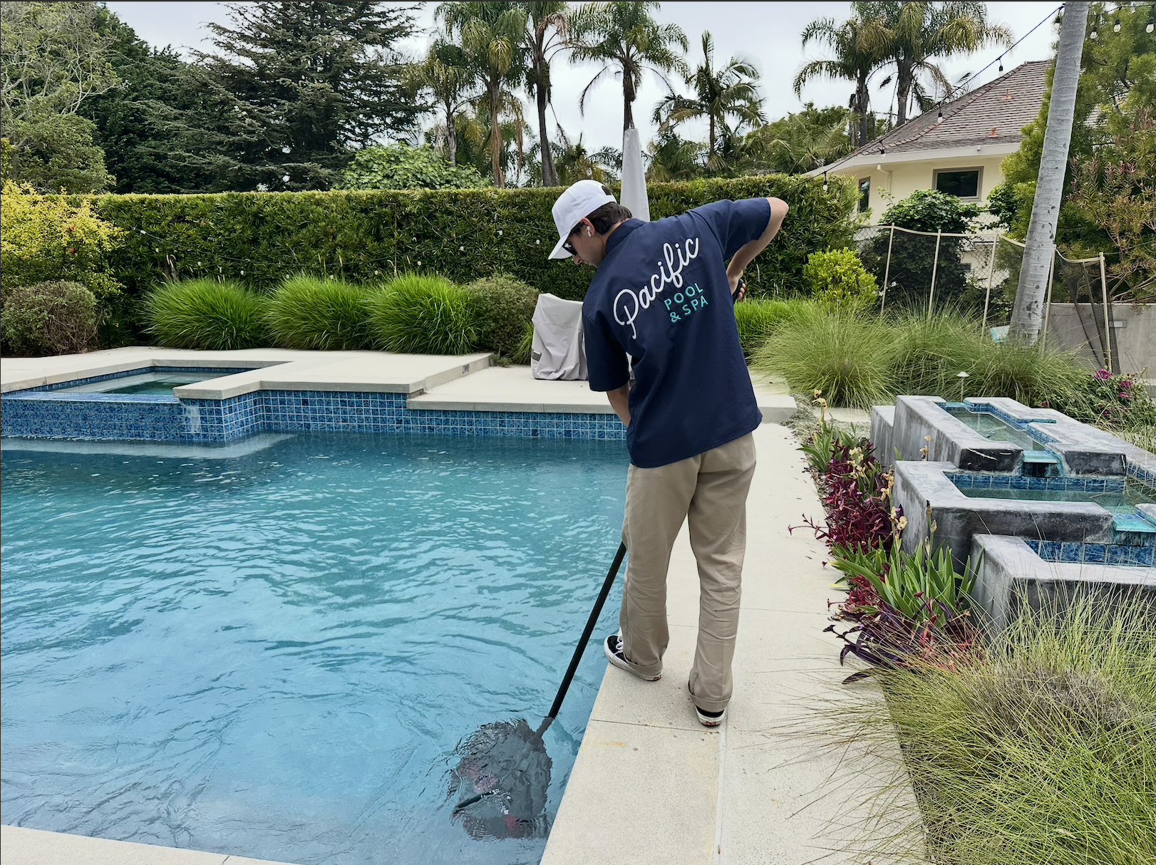 Pacific Pool & Spa technician servicing a residential pool in Torrance, CA