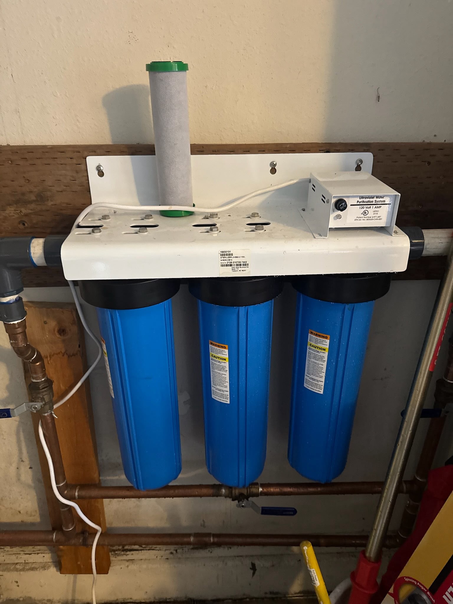 Triple Big Blue filtration manifold with integrated UV ultraviolet water disinfection unit