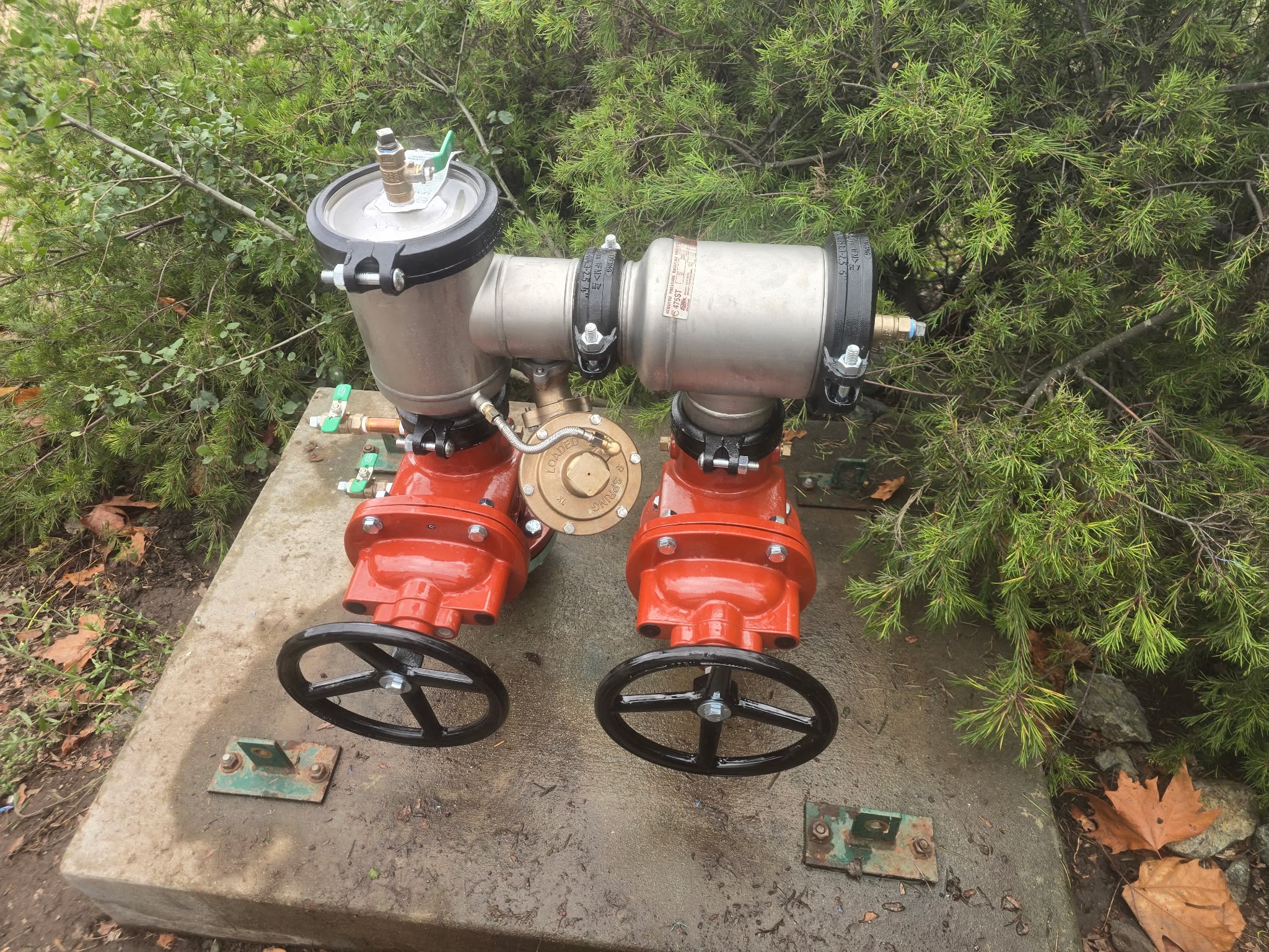 Commercial backflow preventer and double-check assembly installed on concrete pad in the Bay Area
