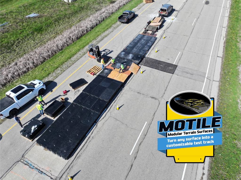Aerial view of crew installing Motile modular test track on roadway