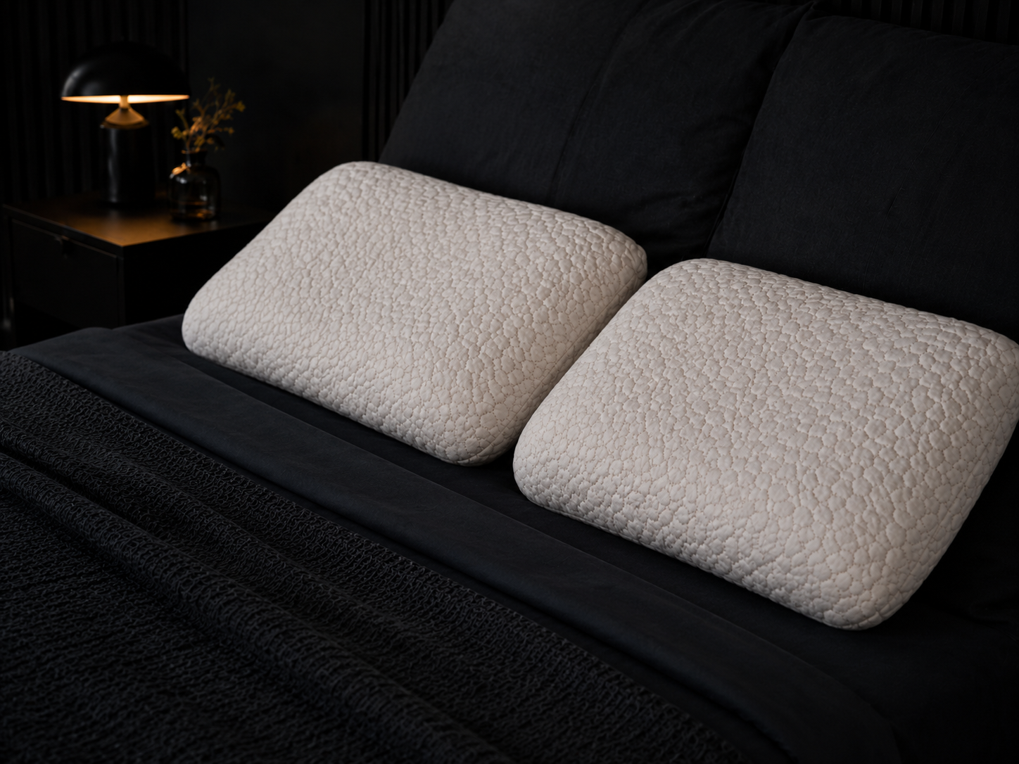 Two Chiropure pillows on a bed